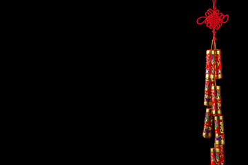 Chinese New Year decoration: Decorative Chinese firecrackers, isolated on black background, copy space