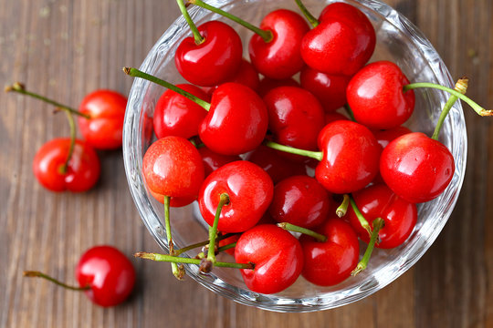 red cherries in a glass fruit dish