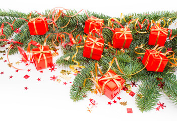 Christmas or New Year background: fur-tree, branches, gifts, decoration on a white background