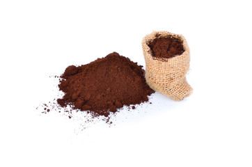 Ground coffee pile with sack  isolated on white background