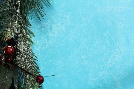 Xmas granland background on blue background with free space