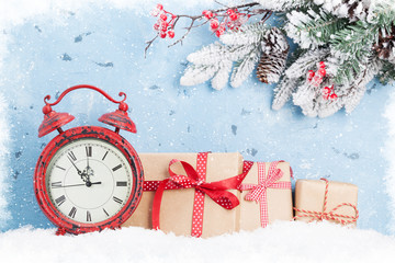 Christmas gift boxes, clock and fir tree
