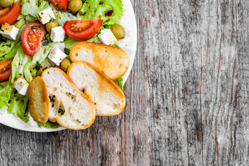 Vegetarian salad, vegetable greek salads, top view, copy space