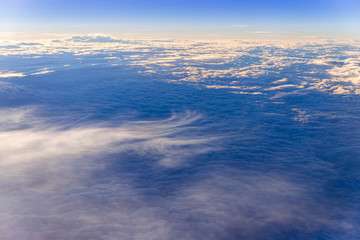 the sea of clouds sunset sky background, view from the window of