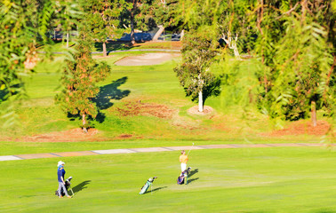 playing golf on a sunny day
