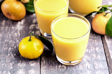 Fresh juice of ripe mandarins in a small glass