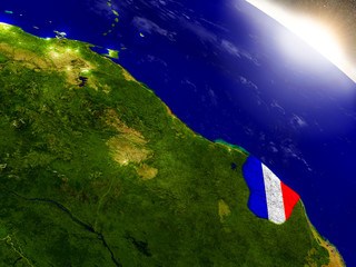 French Guiana with flag in rising sun