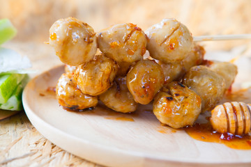 Grilled meatballs with spicy sweet sauce, selective focus