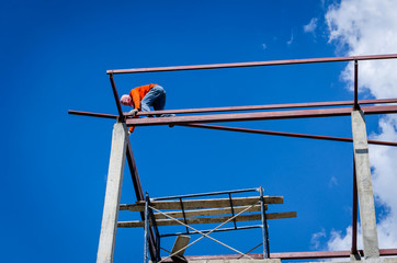 Construction workers working on high risk