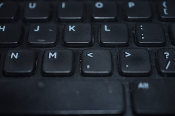 Close-up of a nlack dusty computer keybaord