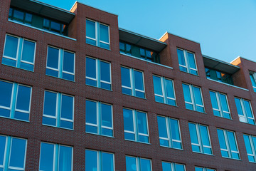 brick office building with blue windows