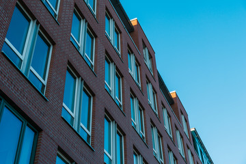 brick office building exterior in low angle view