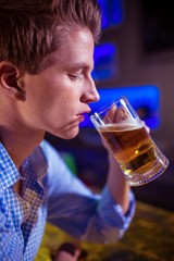 Young man drinking beer