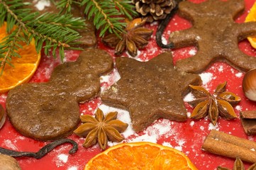 Christmas baking gingerbread, background: gingerbread, cinnamon, star anise, vanilla and cookie cutters.