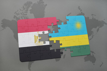 puzzle with the national flag of egypt and rwanda on a world map.