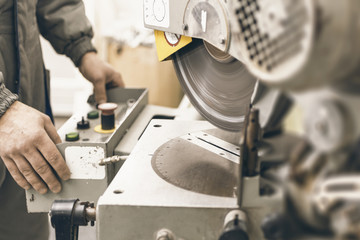 Worker Testing Circular Saw. Plastic Window and Door Industry Production.