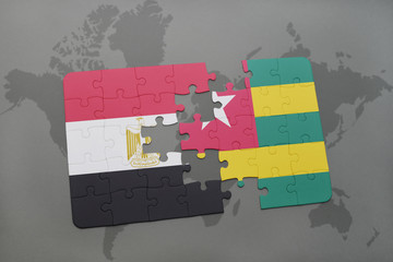 puzzle with the national flag of egypt and togo on a world map.