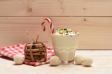 Milk shake with coconut candies and cookies