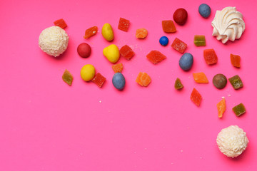 Candies on pink background