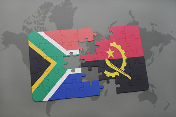 puzzle with the national flag of south africa and angola on a world map.