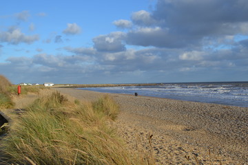 Fototapeta na wymiar beach sand dunes sky clouds 