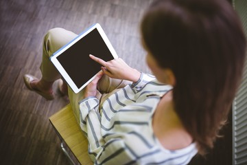 High angle view of executive using tablet at office
