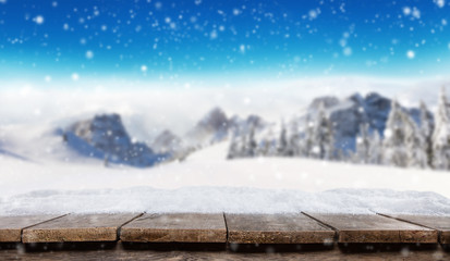 Empty wooden planks with winter alpine mountains