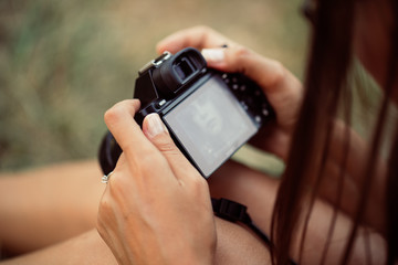 professional camera in the hands of women