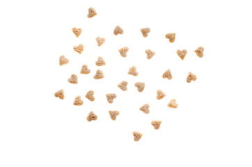 Oat muesli in the form of hearts on a white background