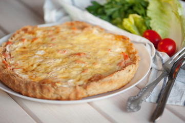 open pie with salmon, spinach and dill.