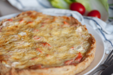 open pie with salmon, spinach and dill.