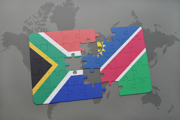 puzzle with the national flag of south africa and namibia on a world map.