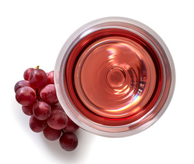 Glass of rose wine and grapes