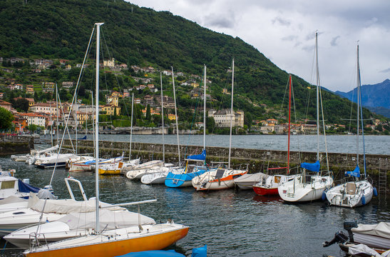 Como lake. Pier with yachts.