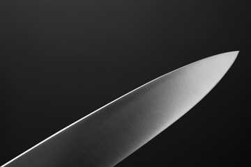 Big kitchen knife close up on dark background - Powered by Adobe