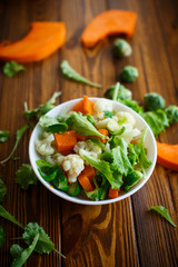 salad of lettuce, cauliflower and Brussels sprouts with a pumpkin