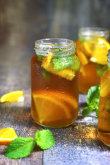 Orange iced tea in a glass jar.