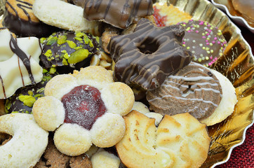Christmas biscuits / Christmas biscuits and gingerbread on golden plate, close up, macro, full...