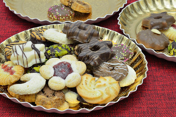 Christmas biscuits / Christmas biscuits and gingerbread on golden plate, close up, macro, full...
