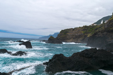 Fototapeta na wymiar Clouded day at Natural pools in Seixal (Posto de Correios de Seixal), Madeira, Portugal