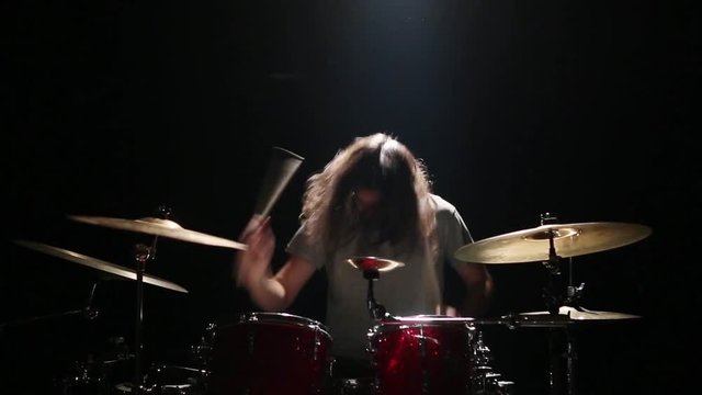bearded drummer playing in the studio