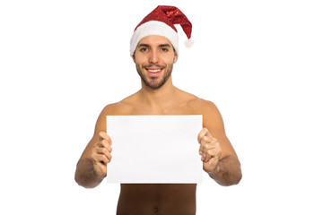 happy santa man is holding and presenting a big blank board