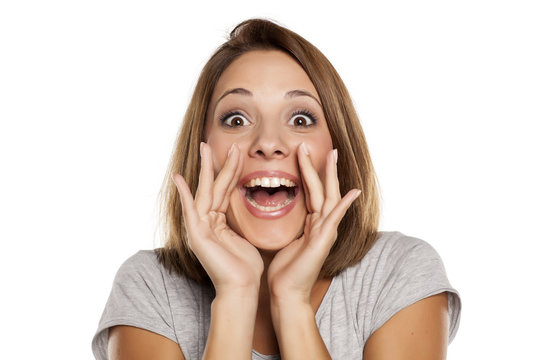 happy woman yelling with hands next to the mouth