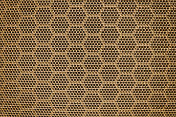 Plastic grille in a honeycomb. Grid of audio amplifier background.