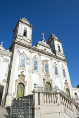 Fototapeta na wymiar Weathered neoclassical colonial facade of the Ordem Terceira do Carmo church in Salvador, Bahia, Brazil under bright blue sky