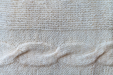 Pattern knitted on the needles close up