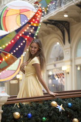 Beautiful happy woman in yellow dress dress