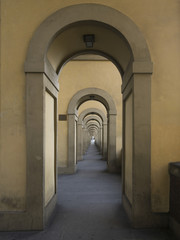 Arched corridor on a building exterior.