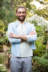 Portrait of confident owner at community garden