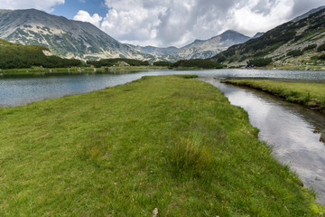Panorama of Banderishki Chukar and Todorka Peaks and reflection in Muratovo lake, Pirin Mountain, Bulgaria